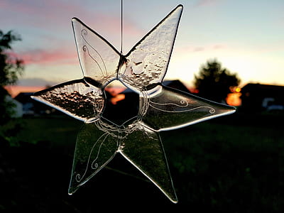 selective focus photography of clear star hanging ornament thumbnail