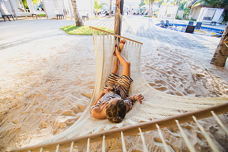 Woman On Hammock At Beach Photo thumbnail