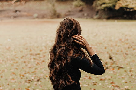 woman holding her hair thumbnail
