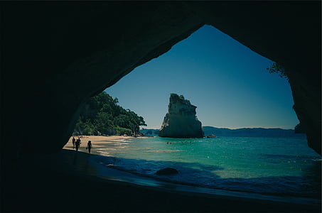 people near rock monolith thumbnail