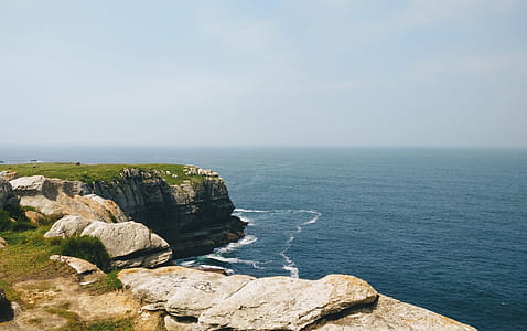 Gray Rock Mountain Cliff Near Sea Photo Taken thumbnail