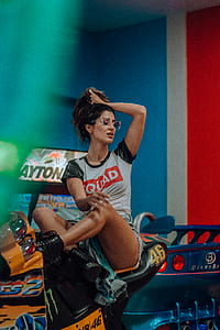 woman sitting on orange and black sport motorbike thumbnail