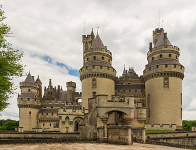 beige and gray concrete castle under white cloudy sky at daytime thumbnail