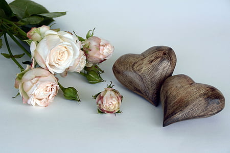 white flowers and brown wooden heart decoration thumbnail