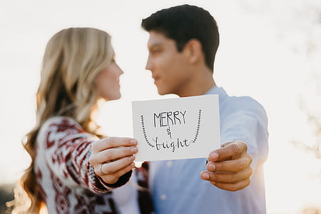 couple holding paper thumbnail