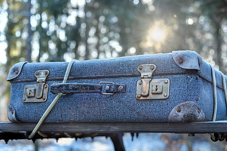 gray travelling case on vehicle roof thumbnail