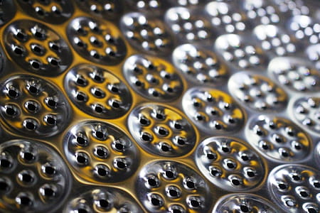 Abstract futuristic background of metallic cogs and wheel shapes in light and shadow thumbnail