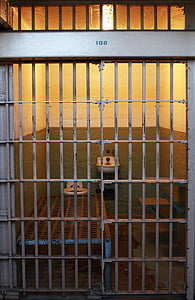 closed gray metal gate jail thumbnail