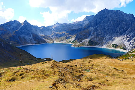 lake surrounded by mountains thumbnail