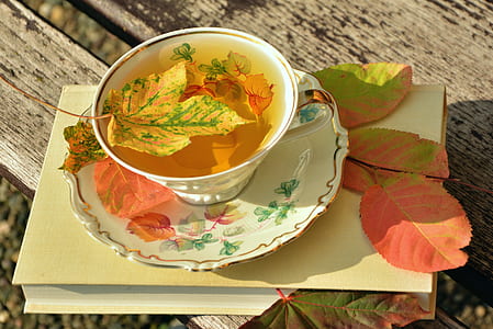 white ceramic teacup set full of tea thumbnail