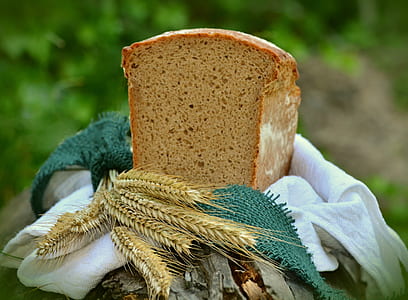 sliced banana bread on top of white textile with grains thumbnail