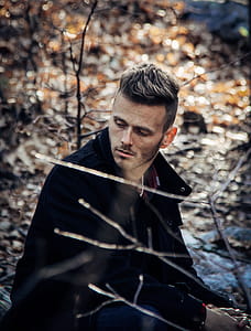 Close-Up Photography of a Man Wearing Black Coat thumbnail
