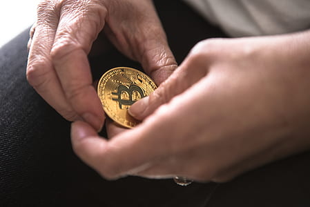 person holding bitcoin thumbnail