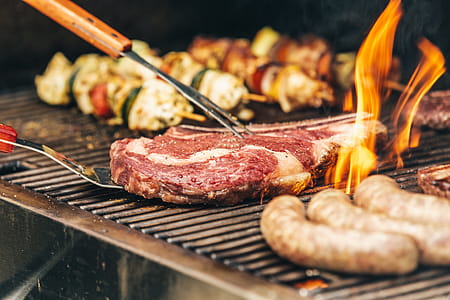 Steak And Flames On The Grill Photo thumbnail