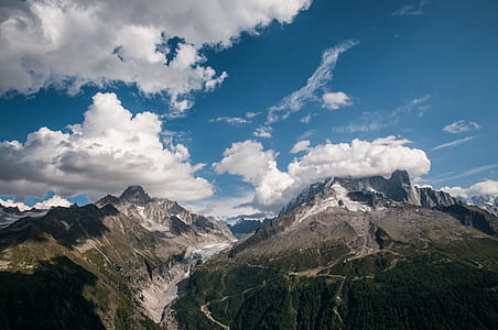 white clouds on top of mountains thumbnail