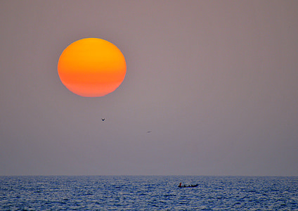 people riding boat in sunraise thumbnail