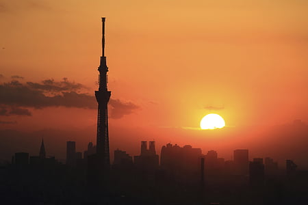 silhouette photo of tower during golden hour thumbnail