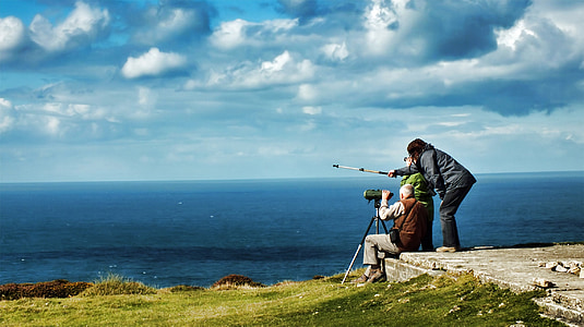 three people looking at the sea thumbnail