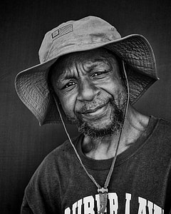 grayscale photo of man wearing bucket hat thumbnail