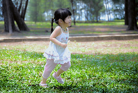 child running on grass field thumbnail