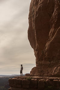 man standing on cliff thumbnail