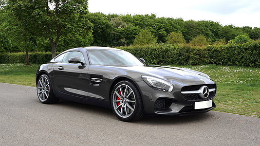 black Mercedes-Benz GT coupe on road thumbnail