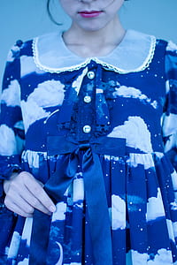 woman wearing blue and white half-button dress thumbnail