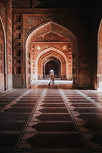 man standing inside building thumbnail