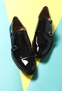 pair of black leather loafers thumbnail