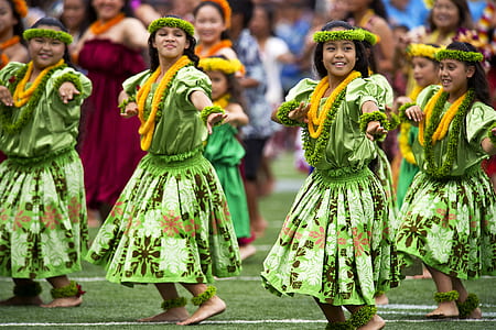 group of women in green floral dress dancing thumbnail
