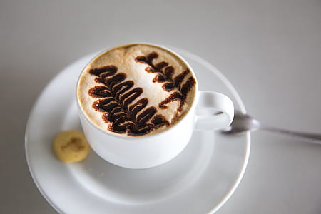 shallow focus photography of white ceramic teacup and saucer thumbnail