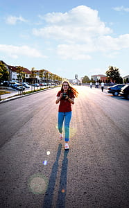 Woman in Red Blouse Holding Black Dslr thumbnail