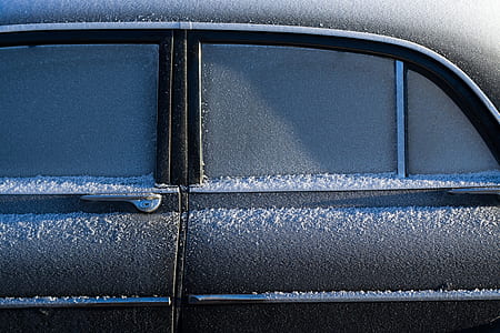 black vehicle doors with snow thumbnail