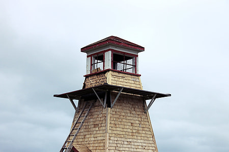 brown and red lighthouse during daytime thumbnail