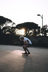 man playing skate on concrete road thumbnail