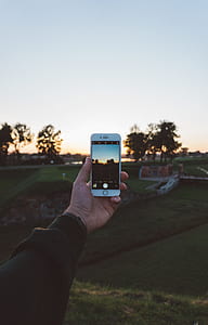 person capturing photo using iPhone 6 thumbnail