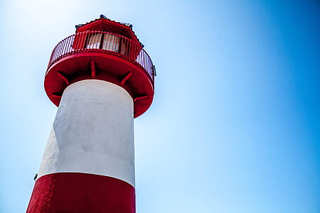 white and red concrete lighthouse thumbnail