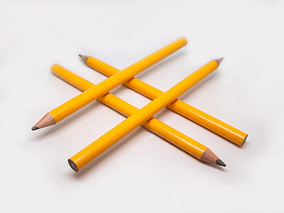 four orange pencils on white surface thumbnail