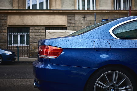 blue car showing red taillight outside thumbnail