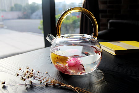 clear glass kettle on black wooden table thumbnail