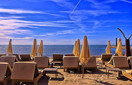lounge chairs on seashore thumbnail