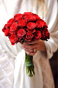person holding red rose bouquet thumbnail
