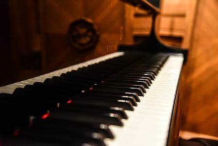 close-up photography of brown upright piano thumbnail
