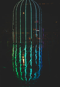 man walong on pathway during night time thumbnail