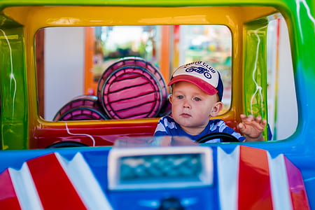 baby riding on vehicle toy thumbnail