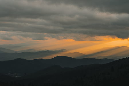 mountain rage view under cloudy sky during daytime thumbnail