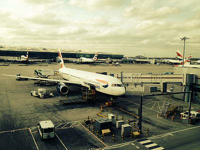sephia photography of airplane on tarmac thumbnail