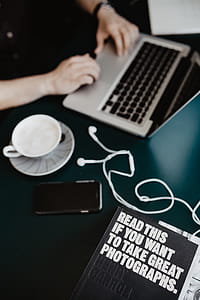 Male working with a laptop and a cup of coffee thumbnail