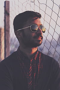 man in black cardigan thumbnail
