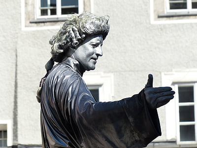 selective focus photo of man wearing black top statue thumbnail